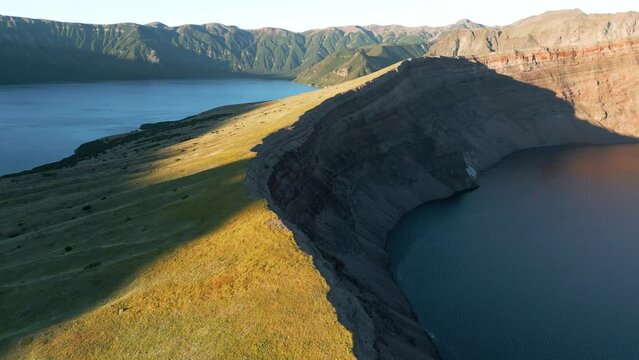 Lake in green lined caldera of huge volcano. Aerial of Corvo, Azores.