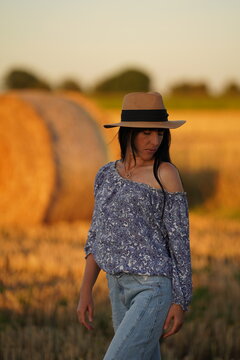 A Girl With A Bare Shoulder And Long Hair