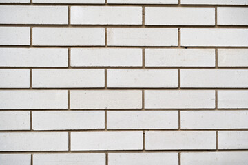 Obraz premium The texture of a white brick wall, a straight view