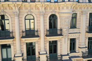 Naklejka premium Detail of yellow art nouveau building facade of building in Riga, Latvia, Europe