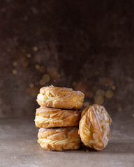 cakes with cream and slivered almonds and a beautiful bokeh