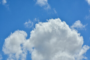 White clouds against blue sky for a backgrounds