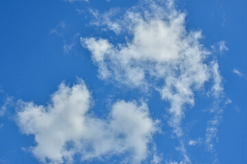 White clouds against blue sky for a backgrounds