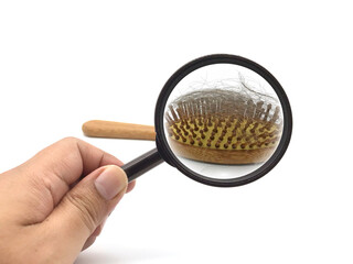 hand holding magnifying glass