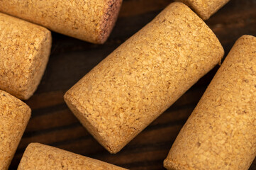 Wine corks scattered on a wooden background. Close-up, selective focus