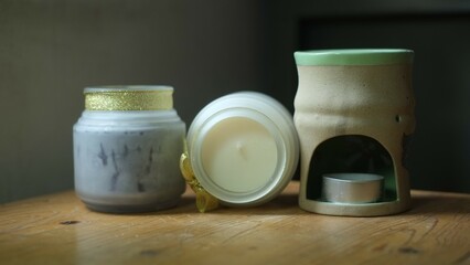 scented candles on wooden table