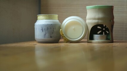 scented candles on wooden table