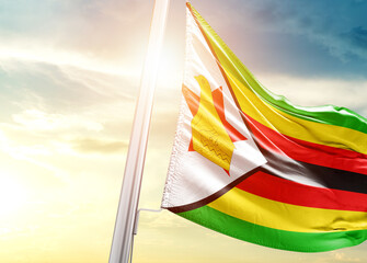 Zimbabwe national flag cloth fabric waving on the beautiful sunlight - Image - obrazy, fototapety, plakaty