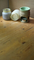 scented candles on wooden table