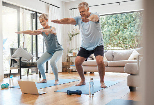 Yoga, online class and senior couple in living room, workout, zen and fitness in retirement for man and woman with laptop. Stretching, balance and old people exercise at home streaming pilates video.