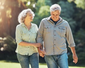 Nature, walk and a senior couple holding hands in park laughing and romance in retirement. Outdoor garden, love and elderly man and happy woman on romantic walking date in a field on summer weekend