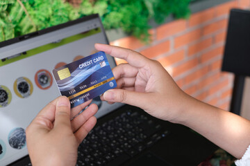 woman holding credit card and use laptop for with shopping online. Online payment concept. - Image
