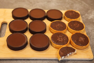 Chocolate tart with salted caramel and nuts. Birthday and Christmas dessert. Top view. Side view.  Holiday pastry. Nut turts.