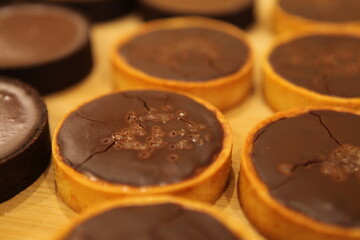 Chocolate tart with salted caramel and nuts. Birthday and Christmas dessert. Top view. Side view.  Holiday pastry. Nut turts.