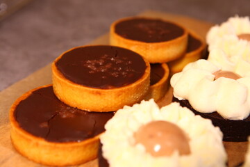 Chocolate tart with salted caramel and nuts. Birthday and Christmas dessert. Top view. Side view.  Holiday pastry. Nut turts.