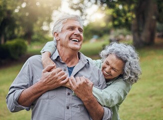 Senior couple hugging in park, garden and retirement to relax, wellness and fresh air in nature in Australia together. Happy man, funny woman and playful elderly people laughing, enjoy joke and love