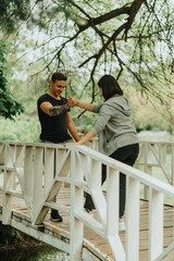 Couple shaking hands on the bridge