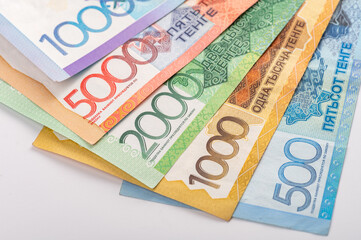 Kazakhstan money - tenge. 500, 1000, 2000, 5000, 10000 banknotes. Close up of tenge on white background.