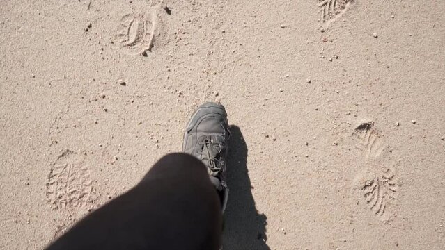 close up woman's feet running on the white sand of the beach in abel tasman national park 