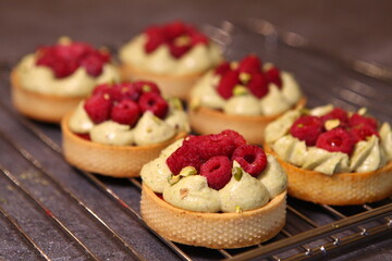 Tarts with raspberry and cream. Pie with meringue. Set of desserts. Set of tarts.