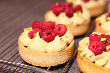 Tarts with raspberry and cream. Pie with meringue. Set of desserts. Set of tarts.