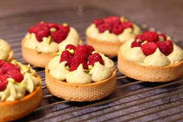 Tarts with raspberry and cream. Pie with meringue. Set of desserts. Set of tarts.
