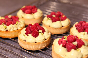 Tarts with raspberry and cream. Pie with meringue. Set of desserts. Set of tarts.
