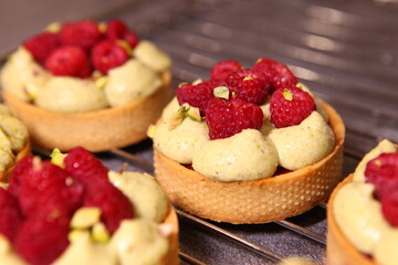 Tarts with raspberry and cream. Pie with meringue. Set of desserts. Set of tarts.