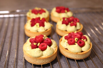 Tarts with raspberry and cream. Pie with meringue. Set of desserts. Set of tarts.
