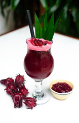 Hibiscus ice tea on a white background closeup  