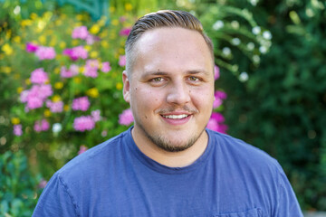 Friendly smiling young man with mustache and beard