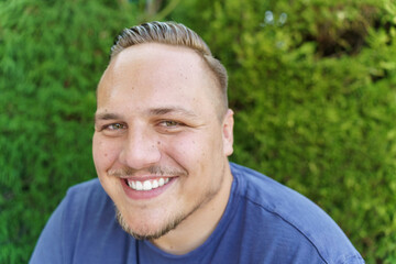 Happy friendly young man with a beaming smile