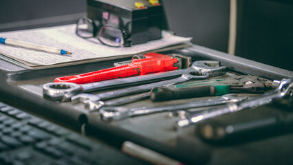 different tools laid on the table of car workshop
