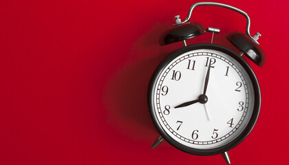 red alarm clock on white background