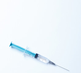 Fototapeta premium Medical syringe on a white background. A syringe for injection. The concept of health and beauty