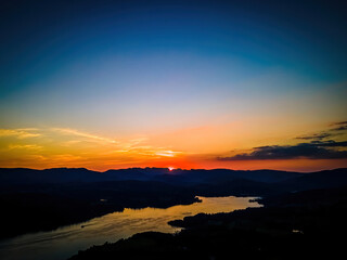 Aerial view of sunset over Windermere in Lake District, a region and national park in Cumbria in northwest England