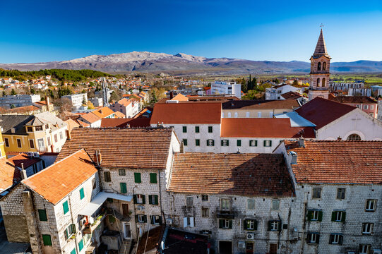 Town of Sinj in Dalmatia hinterland aerial view, southern Croatia. Panoramic view of small picturesque town Sinj in Croatia, Europe.