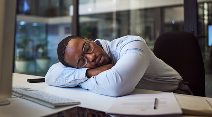 Black man in business, tired and sleeping on night office desk after programming computer code,...