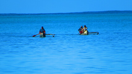 fishermen in traditional Samoan fisher boats 