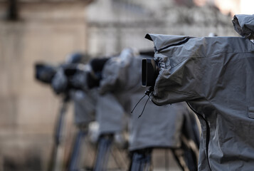 Television live broadcasting production professional cameras on tripod with rain covers on them...