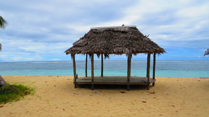 A traditional beach hut on the island of Samoa in the pacific ocean 