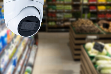 CCTV video surveillance system in a shopping mall supermarket blur background