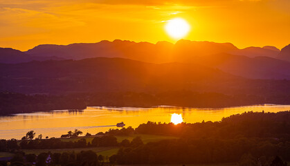 View of sunset over Windermere in Lake District, a region and national park in Cumbria in northwest England