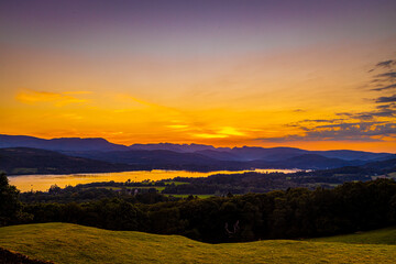 View of sunset over Windermere in Lake District, a region and national park in Cumbria in northwest England