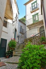 A narrow street between the old stone houses of Pizzone, a medieval village in the Molise region of Italy.