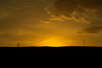 Silhouette of Power lines at sunset hour