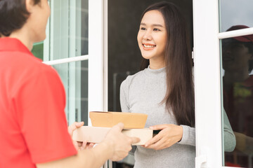 Postman, service fast food online asian young woman hand received order, delivery man, male holding, carrying paper containers, pizza box send to customer house. Deliver, courier bring product to door
