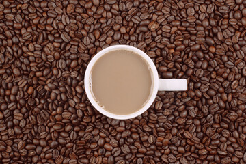 Cup of coffee and beans overhead shot