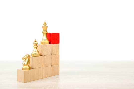 King chess pieces stand with team in vertical concepts of challenge of leader business teamwork volunteer or wining and leadership strategic plan and risk management or team player.