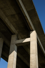 Fototapeta premium Under the pillar bridge on a sunny day